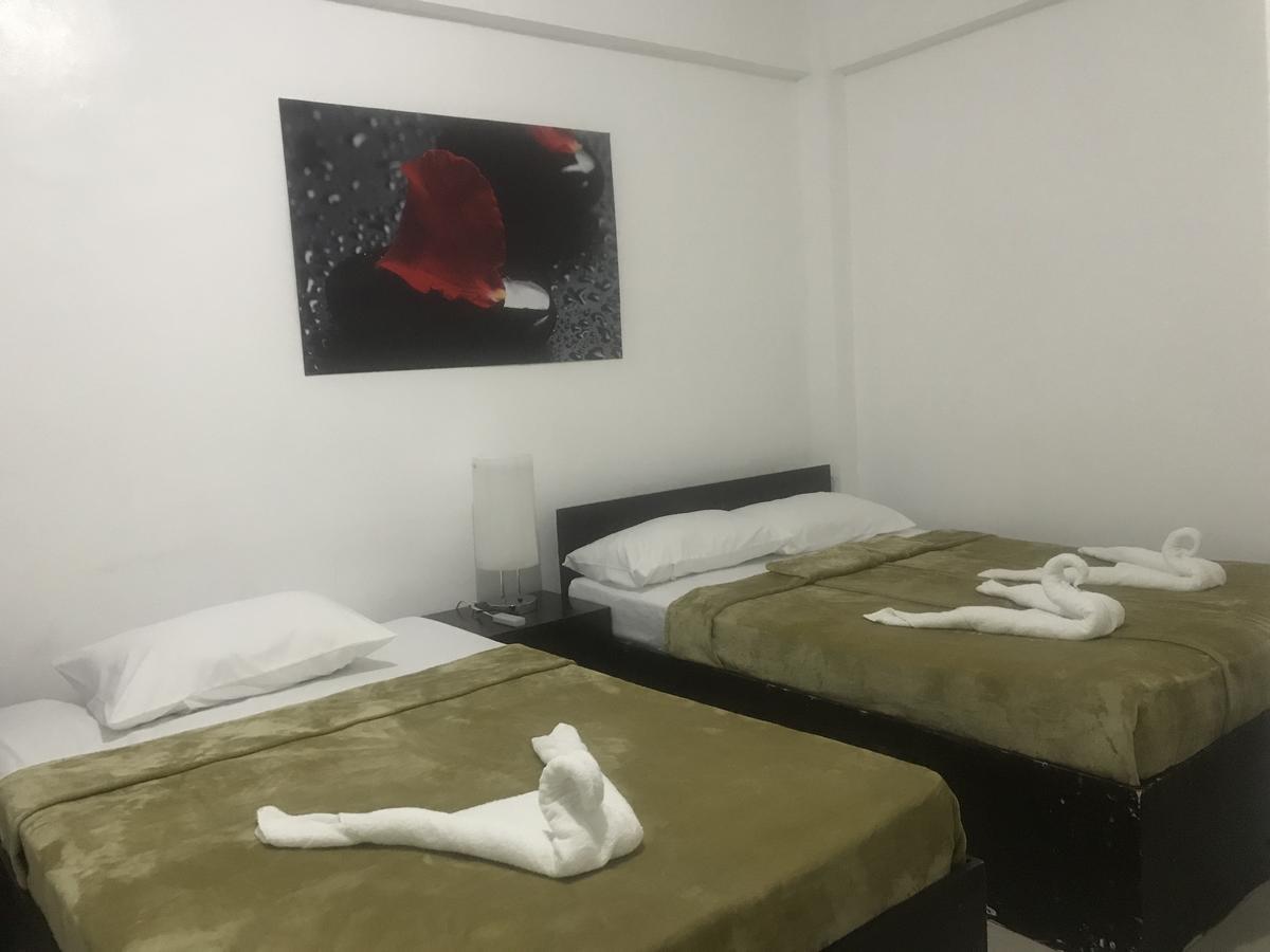 4C'S Tourist Lodge Puerto Princesa ภายนอก รูปภาพ