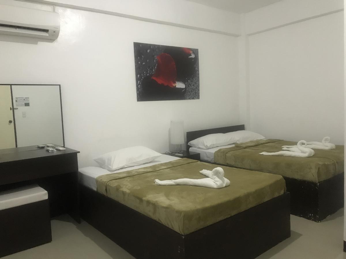 4C'S Tourist Lodge Puerto Princesa ภายนอก รูปภาพ