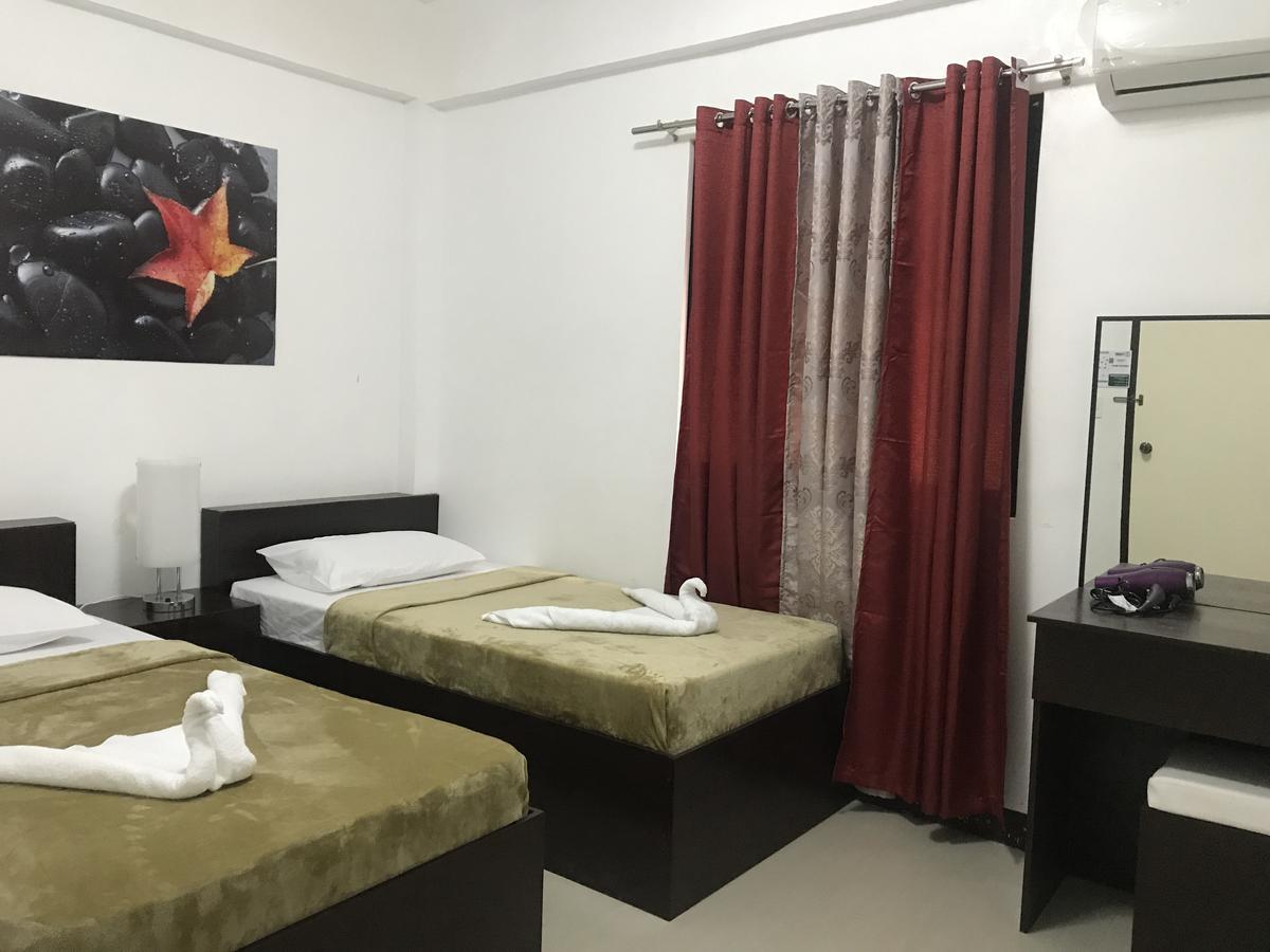 4C'S Tourist Lodge Puerto Princesa ภายนอก รูปภาพ