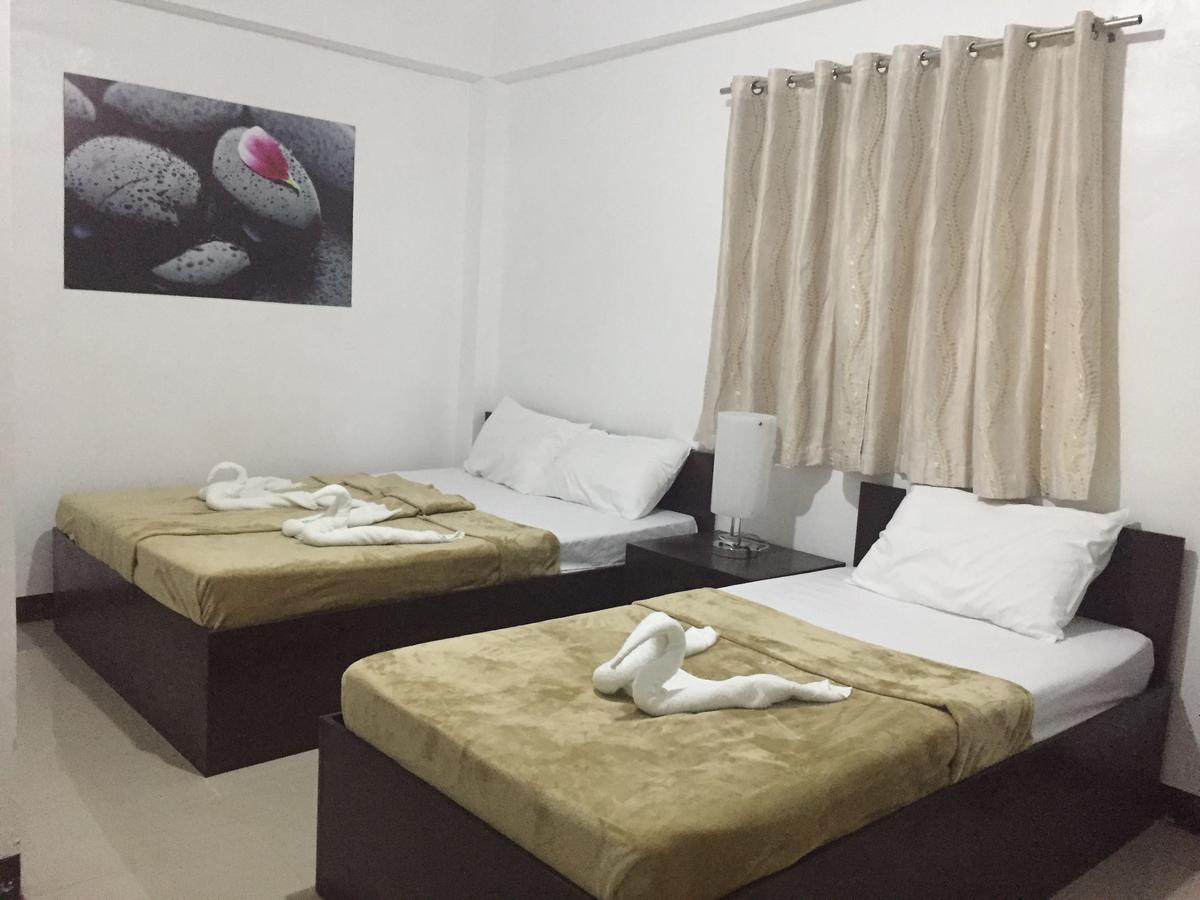 4C'S Tourist Lodge Puerto Princesa ภายนอก รูปภาพ